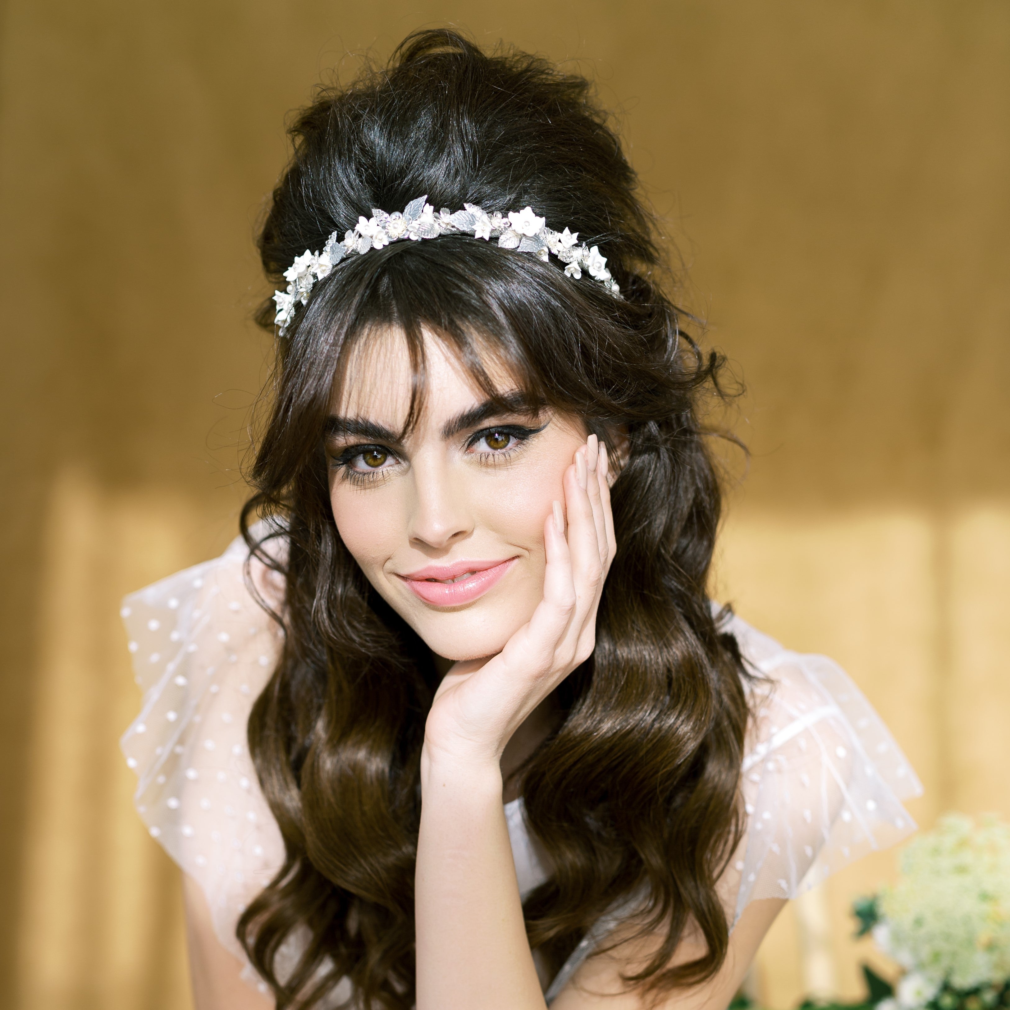 bridal clay flower headband with enamel painted leaves, plated brass leaves, sprigs of pearls and metal flowers. Handwired to a metal headband and  wrapped with metallic ribbon. In silver, gold or rose gold with white or ivory flowers. Made in Toronto Canada, by Blair Nadeau Bridal Adornments